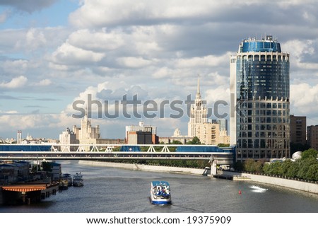 Cloudy sky at Moscow. Beautiful look from third transport ring at modern buildings and foot bridge over Moscow river.