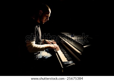 Pianist playing on electric piano