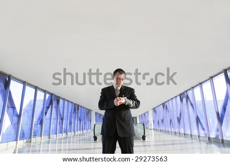 Businessman looking at watches at airport