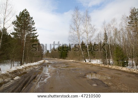 Rural road at winter day at very bad condition