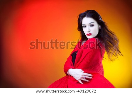 Studio shot of beautiful woman with pale face.