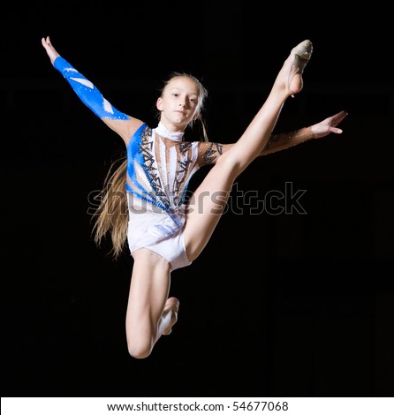 12 years old girl doing rhythmic gymnastics