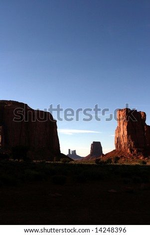 The Sun Setting over the floor of Monument Valley in Arizona Utah