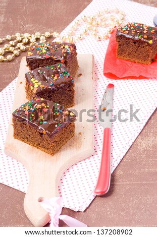 Chocolate fudge cake decorated with hundreds and thousands