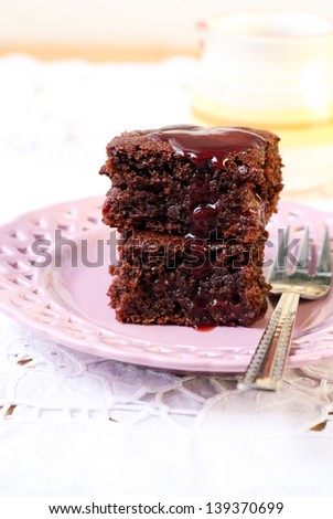Low fat chocolate cherry cake slices with sweet sauce