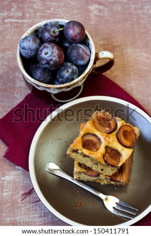 Plum cake bars and bowl of plums
