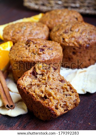 Carrot and marmalade muffins with cinnamon sticks and orange slices