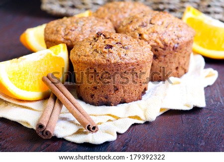Carrot and marmalade muffins with cinnamon sticks and orange slices