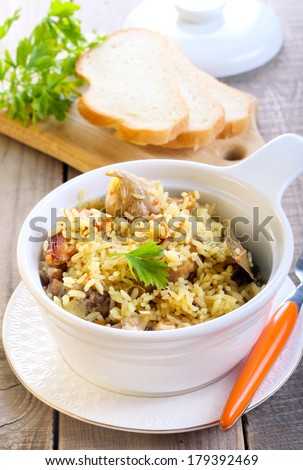 Rice and chicken casserole on table