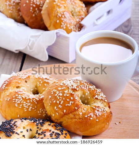 Homemade bagels, and cup of coffee, square image