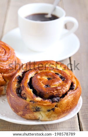 Bun and cup of coffee