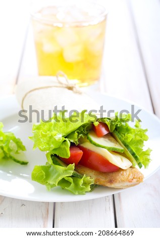 Chicken, tomato, cheese and cucumber wrap