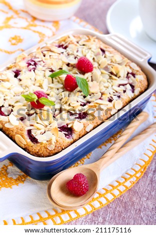 Berry pudding with almond topping