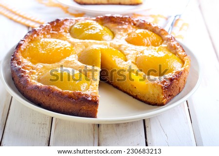 Peach cake on plate, selective focus