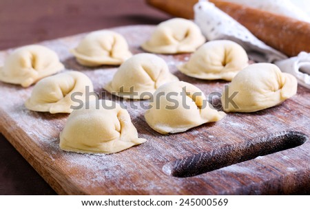 Raw pastry dumplings with meat filling called pelmeni