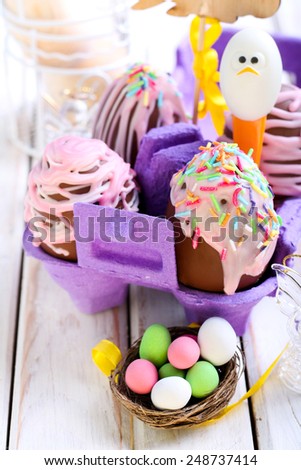 Homemade easter chocolate eggs with glaze and sprinkles