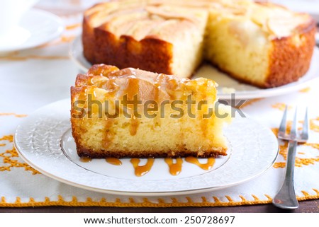 Slice of pear cake with caramel drizzle  on plate
