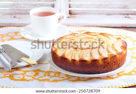 Slice of pear topped cake on plate