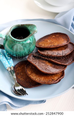 Chocolate whole wheat pancakes  with chocolate sauce