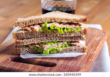 Tuna and brown bread sandwiches on board
