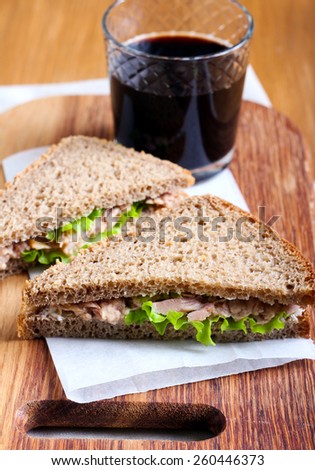 Tuna and brown bread sandwiches on board