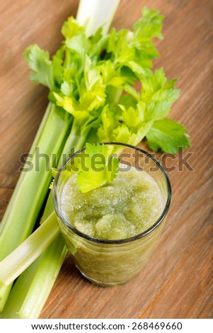 Celery fresh in glass and celery stalks