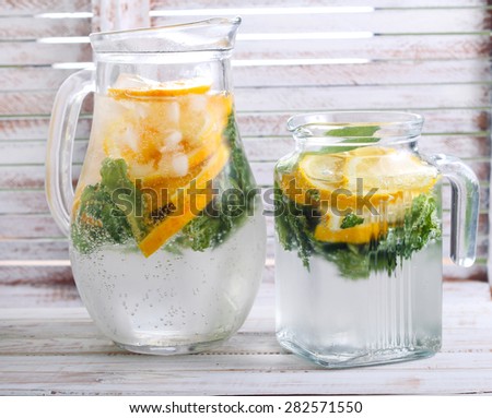 Citrus and mint sparkling water in jars