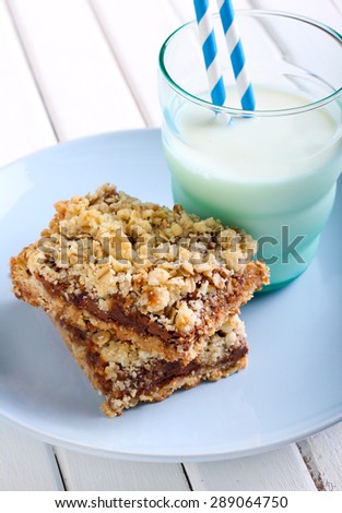Chocolate and caramel oat bars and glass of milk