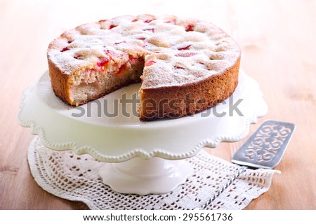 Plum sponge cake with icing sugar on top