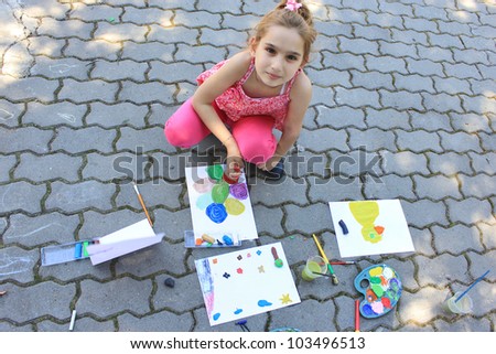 Girl painting outside