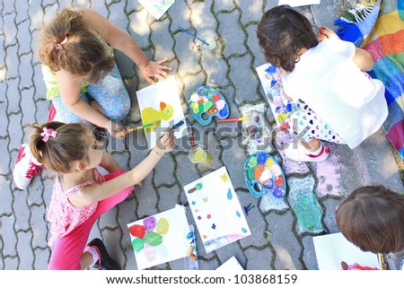 Girls painting outside