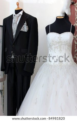 Men suite and white wedding dress