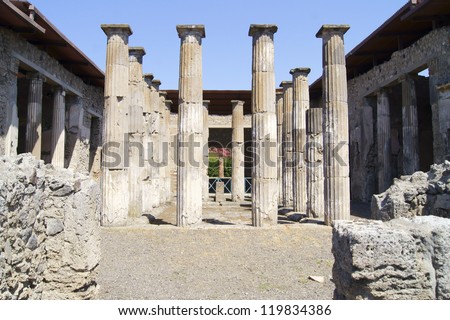 Patio, decorated classic antique columns in a villa in Pompeii