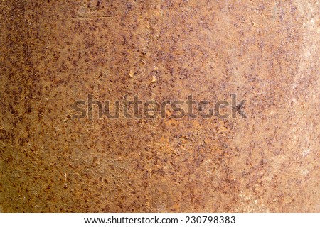 The texture of the surface of the iron barrel covered with rust