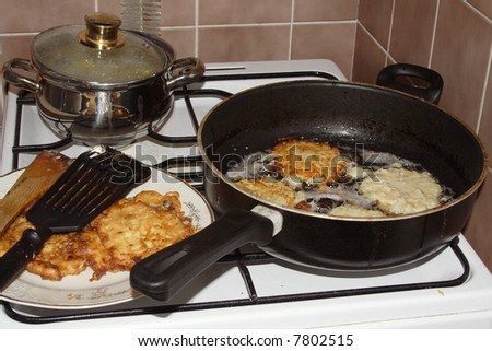 cooking range and roasting chicken steak