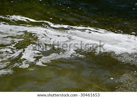 Dirty water with white  pollution