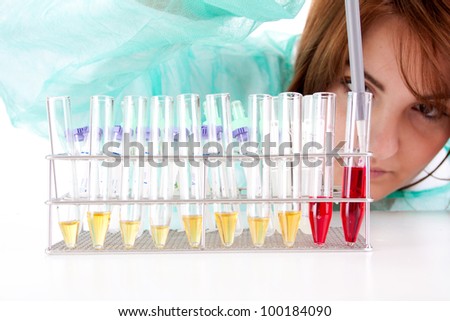 A female medical or scientific researcher or woman doctor working with samples