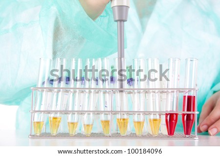 A female medical or scientific researcher or woman doctor working with samples