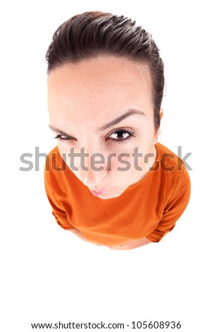 Woman wondering funny looking to side pondering something while scratching head. High angle view.