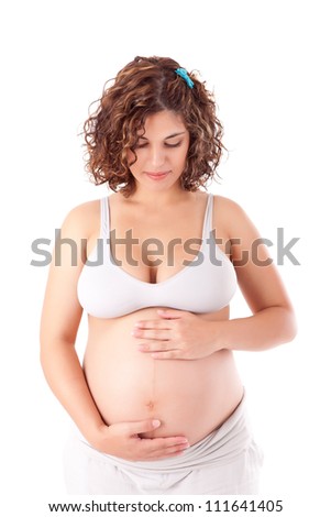 Beautiful pregnant woman showing her good shape