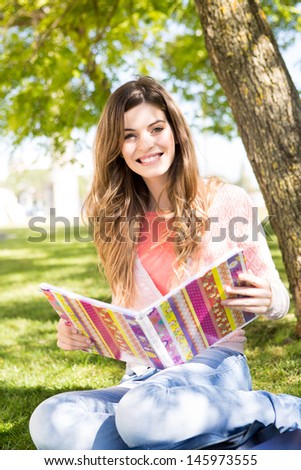 Young student studying at the school garden