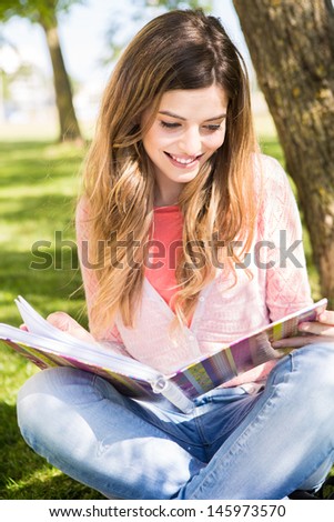 Young student studying at the school garden