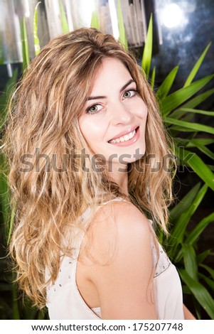 Portrait of a blond woman in a beauty center