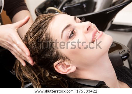 Beautiful Woman Washing Her Hair In Hairsalon