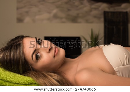 Woman relaxing in spa beauty center - Soft light