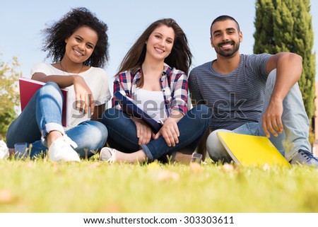 Students sitting on the grass at School Campus