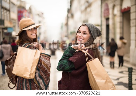 Young trendy women shopping in the city