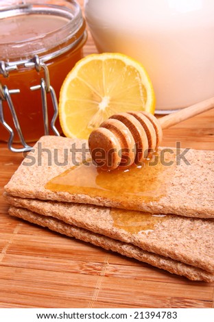 Honey on bread, milk and lemon