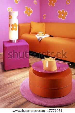 living room with orange sofa