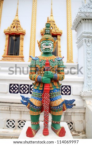 NONTHABURI- AUG 18: Colorful statue of Thai giant guardian with red rod at wat Bang Phai on Aug 18, 2012 in Nonthaburi, Thailand. Wat Bang Phai, built on 1767, is the Buddhist school for monks.